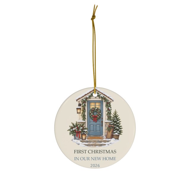 Round ceramic ornament printed with a blue front door and the words First Christmas in Our New Home 2026